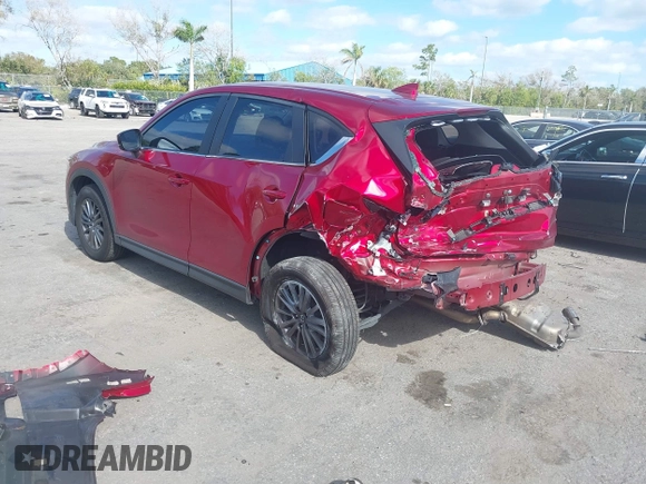 2020 Mazda CX-5 Sport with VIN JM3KFABM7L1819493, listed as a IAAI auction lot 41304240 with 52,940 mi miles. Bid and sale history available at carsss.com. Image 3.