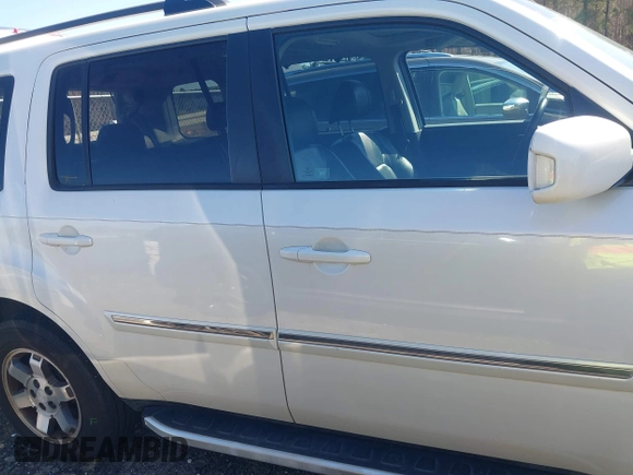2011 Honda Pilot Touring with VIN 5FNYF4H97BB067954, listed as a IAAI auction lot 41832617 with 141,141 mi miles. Bid and sale history available at carsss.com. Image 13.