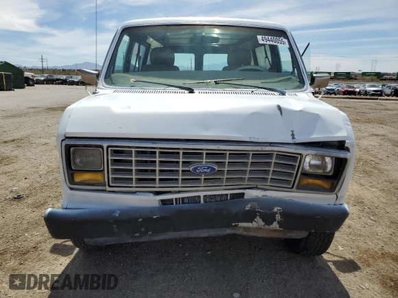1989 Ford Econoline Cargo with VIN 1FTEE14Y2KHC41026, listed as a Copart auction lot 49440055 with 54,481 mi miles and Salvage Title. Bid and sale history available at DreamBid. Image 5.