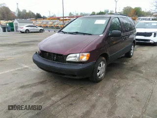2000 Toyota Sienna LE with VIN 4T3ZF13C8YU209477, listed as a IAAI auction lot 41952970 with 293,084 mi miles. Bid and sale history available at carsss.com. Image 2.