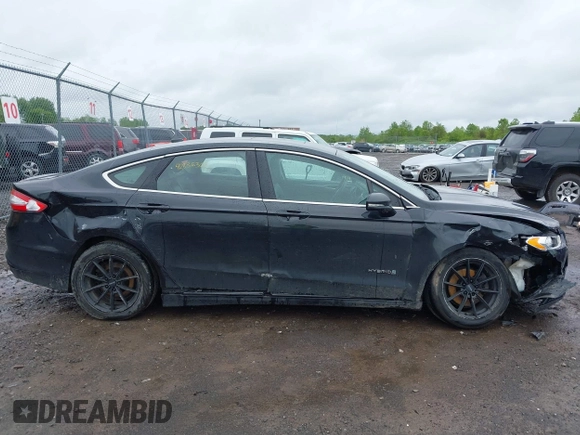2014 Ford Fusion SE Hybrid with VIN 3FA6P0LU9ER310990, listed as a IAAI auction lot 42336303 with 197,588 mi miles and . Bid and sale history available at DreamBid. Image 6.