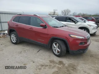 2015 Jeep Cherokee Latitude with VIN 1C4PJLCB3FW712356, listed as a Copart auction lot 51616355 with 153,972 mi miles and Salvage Title. Bid and sale history available at DreamBid. Image 4.