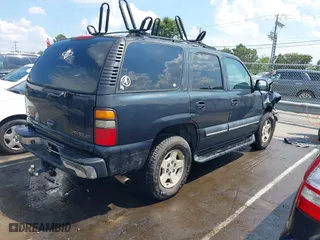 2004 Chevrolet Tahoe LT with VIN 1GNEC13Z04J134981, listed as a IAAI auction lot 39886652 with 244,056 mi miles. Bid and sale history available at carsss.com. Image 4.