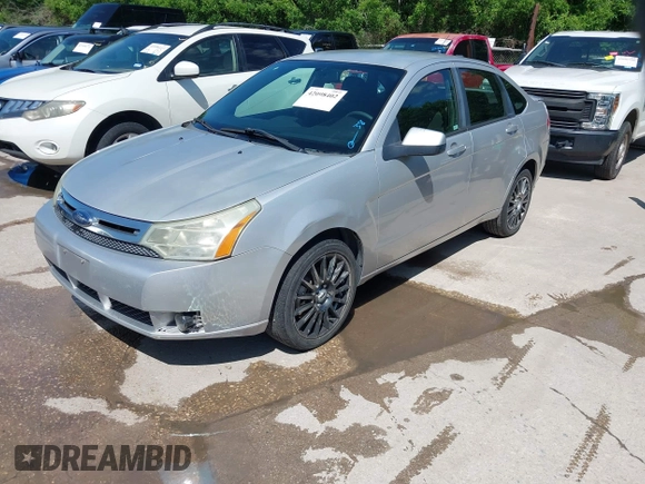 2009 Ford Focus SES with VIN 1FAHP36N69W102910, listed as a IAAI auction lot 42098402 with 149,957 mi miles. Bid and sale history available at carsss.com. Image 2.