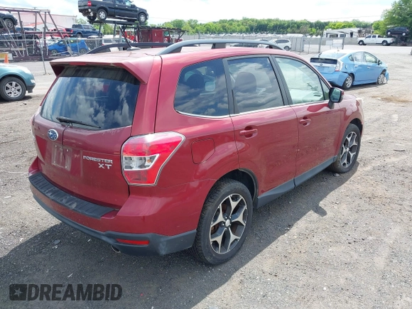 2014 Subaru Forester XT Touring with VIN JF2SJGMC1EH500150, listed as a IAAI auction lot 42201409 with 106,728 mi miles and . Bid and sale history available at DreamBid. Image 4.