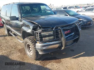 1999 GMC Suburban with VIN 3GKEC16R7XG527908, listed as a IAAI auction lot 41657788 with 216,894 mi miles. Bid and sale history available at carsss.com. Image 6.