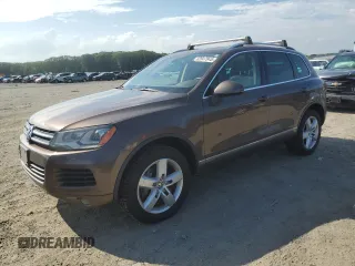 2013 Volkswagen Touareg Lux with VIN WVGEF9BP6DD013932, listed as a Copart auction lot 62047945 with 127,821 mi miles and Clean title. Bid and sale history available at DreamBid. Image 1.