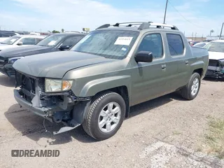 2007 Honda Ridgeline RTL with VIN 2HJYK16577H537990, listed as a IAAI auction lot 42454619 with 182,911 mi miles and . Bid and sale history available at DreamBid. Image 2.