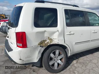 2015 Honda Pilot Touring with VIN 5FNYF3H93FB007766, listed as a IAAI auction lot 41932052 with 131,036 mi miles. Bid and sale history available at carsss.com. Image 6.