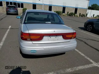 2000 Saturn SL z VIN 1G8ZK5279YZ252761, wystawiony jako Copart lot #63204475 z przebiegiem 80 646 mil mil oraz Czysty tytuł • Clean title. Historia ofert i sprzedaży dostępna na DreamBid. Obrazek 6.