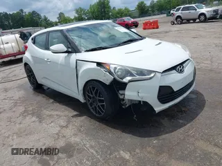 2012 Hyundai Veloster w/Gray Int z VIN KMHTC6AD2CU051503, wystawiony jako IAAI lot #42263325 z przebiegiem 158 411 mil mil oraz . Historia ofert i sprzedaży dostępna na DreamBid. Obrazek 1.
