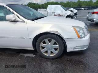 2007 Cadillac DTS Luxury I z VIN 1G6KD57Y67U123765, wystawiony jako IAAI lot #42495242 z przebiegiem 56 193 mil mil oraz . Historia ofert i sprzedaży dostępna na DreamBid. Obrazek 6.