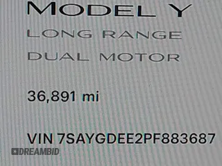 2023 Tesla Model Y Long Range with VIN 7SAYGDEE2PF883687, listed as a IAAI auction lot 41589837 with 36,890 mi miles. Bid and sale history available at carsss.com. Image 16.
