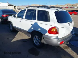 2002 Hyundai Santa Fe GLS with VIN KM8SC73D82U294374, listed as a IAAI auction lot 41204011 with 179,219 mi miles. Bid and sale history available at carsss.com. Image 3.