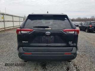 2019 Toyota RAV4 XLE with VIN JTMP1RFV9KD506960, listed as a Copart auction lot 50242025 with 102,157 mi miles and Salvage Title. Bid and sale history available at DreamBid. Image 6.
