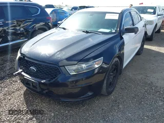 2014 Ford Police Interceptor with VIN 1FAHP2MK8EG185666, listed as a IAAI auction lot 42608018 with 141,523 mi miles and . Bid and sale history available at DreamBid. Image 2.