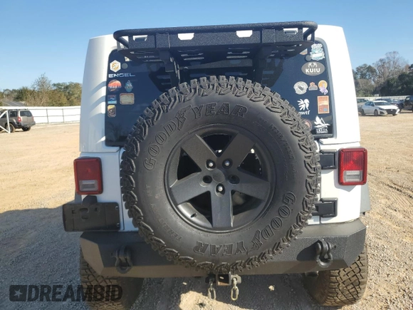 2013 Jeep Wrangler Rubicon with VIN 1C4BJWCG3DL590006, listed as a Copart auction lot 85855594 with 99,218 mi miles and Salvage title. Bid and sale history available at DreamBid. Image 6.