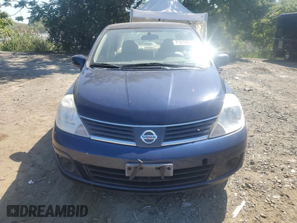 2007 Nissan Versa 1.8 SL with VIN 3N1BC11E27L432802, listed as a Copart auction lot 71018594 with 118,795 mi miles and Salvage Title. Bid and sale history available at carsss.com. Image 5.