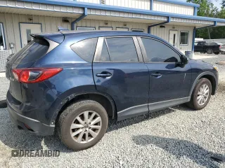 2016 Mazda CX-5 Sport z VIN JM3KE4BY8G0837052, wystawiony jako Copart lot #54700235 z przebiegiem 124 172 mil mil oraz Szkoda całkowita • Salvage title. Historia ofert i sprzedaży dostępna na DreamBid. Obrazek 3.