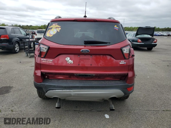 2018 Ford Escape SE z VIN 1FMCU9GD7JUB01668, wystawiony jako Copart lot #57038675 z przebiegiem 70 780 mil mil oraz Szkoda całkowita • Salvage title. Historia ofert i sprzedaży dostępna na DreamBid. Obrazek 6.