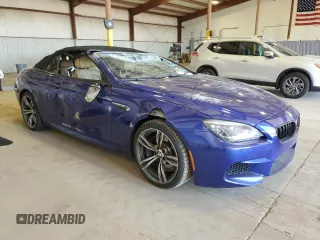2015 BMW M6 z VIN WBSLZ9C54FD651463, wystawiony jako Copart lot #50922005 z przebiegiem Nie podano mil oraz Szkoda całkowita • Salvage title. Historia ofert i sprzedaży dostępna na DreamBid. Obrazek 4.