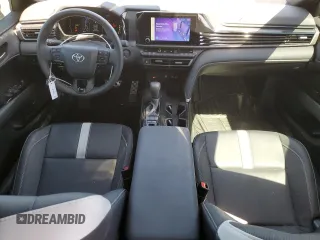 2025 Toyota Camry LE with VIN 4T1DAACKXSU060098, listed as a Copart auction lot 49723885 with 6,934 mi miles and Salvage Title. Bid and sale history available at carsss.com. Image 8.