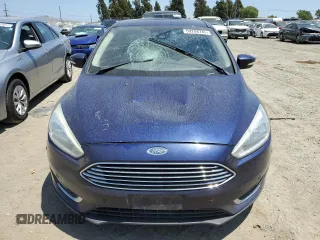 2016 Ford Focus Titanium z VIN 1FADP3J2XGL319399, wystawiony jako Copart lot #59258745 z przebiegiem 215 296 mil mil oraz Szkoda całkowita • Salvage title. Historia ofert i sprzedaży dostępna na DreamBid. Obrazek 5.