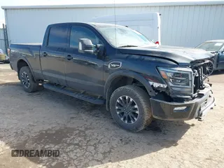 2021 Nissan Titan Platinum Reserve z VIN 1N6AA1FB8MN522767, wystawiony jako IAAI lot #41560745 z przebiegiem 92 875 mil mil oraz . Historia ofert i sprzedaży dostępna na DreamBid. Obrazek 1.