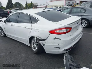 2015 Ford Fusion Titanium Hybrid with VIN 3FA6P0RU3FR247118, listed as a IAAI auction lot 41210219 with 143,348 mi miles. Bid and sale history available at carsss.com. Image 3.