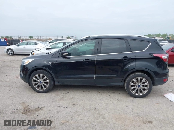 2017 Ford Escape Titanium with VIN 1FMCU0J93HUF10664, listed as a IAAI auction lot 41921588 with 88,377 mi miles. Bid and sale history available at carsss.com. Image 14.
