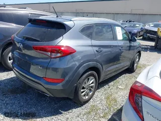 2016 Hyundai Tucson Limited with VIN KM8J33A24GU124543, listed as a IAAI auction lot 41808327 with 38,069 mi miles. Bid and sale history available at carsss.com. Image 4.