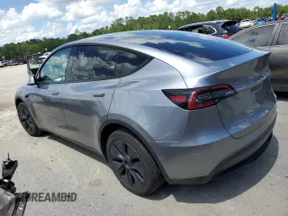 2024 Tesla Model Y Long Range z VIN 7SAYGDEE7RA308338, wystawiony jako Copart lot #61137375 z przebiegiem 19 501 mil mil oraz Szkoda całkowita • Salvage title. Historia ofert i sprzedaży dostępna na DreamBid. Obrazek 2.