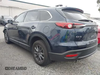 2021 Mazda CX-9 Touring with VIN JM3TCACY9M0526880, listed as a IAAI auction lot 42310923 with 25,991 mi miles and . Bid and sale history available at DreamBid. Image 3.