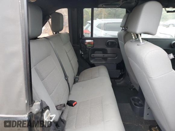 2008 Jeep Wrangler Unlimited Sahara with VIN 1J4GA59148L574934, listed as a Copart auction lot 74590164 with 134,674 mi miles and Salvage title. Bid and sale history available at DreamBid. Image 11.