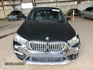 2018 BMW X1 sDrive28i with VIN WBXHU7C34J5L05725, listed as a Copart auction lot 49228475 with 69,994 mi miles and Salvage Title. Bid and sale history available at carsss.com. Image 5.