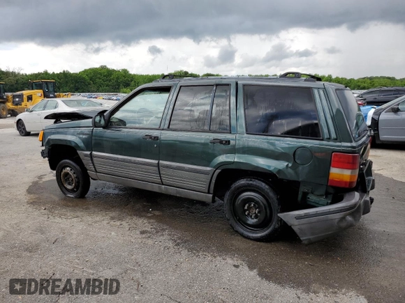 1995 Jeep Grand Cherokee Laredo with VIN 1J4FX58S8SC773884, listed as a Copart auction lot 56572555 with 424,126 mi miles and Salvage title. Bid and sale history available at DreamBid. Image 2.