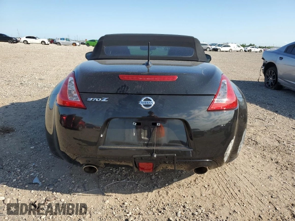 2014 Nissan 370Z Touring with VIN JN1AZ4FH3EM621279, listed as a Copart auction lot 52284814 with 60,479 mi miles and Salvage Title. Bid and sale history available at DreamBid. Image 6.