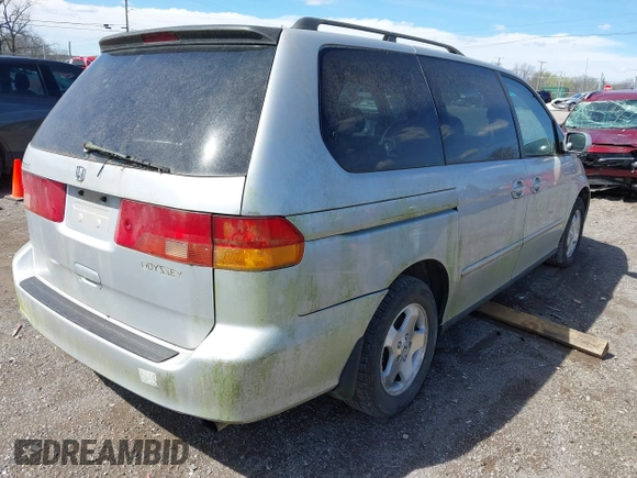 2001 Honda Odyssey EX z VIN 2HKRL18661H597205, wystawiony jako IAAI lot #41838509 z przebiegiem 317 084 mil mil oraz . Historia ofert i sprzedaży dostępna na DreamBid. Obrazek 4.