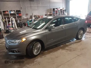 2013 Ford Fusion Titanium Hybrid with VIN 3FA6P0RU6DR319586, listed as a IAAI auction lot 42138979 with 125,388 mi miles. Bid and sale history available at carsss.com. Image 2.