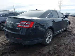 2014 Ford Taurus SEL with VIN 1FAHP2E88EG149396, listed as a IAAI auction lot 41489410 with 190,648 mi miles. Bid and sale history available at carsss.com. Image 4.