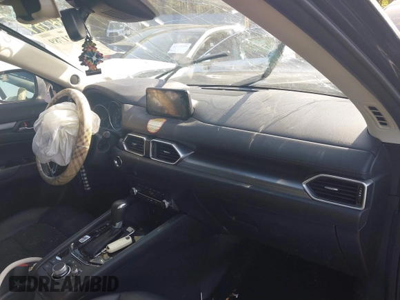 2019 Mazda CX-5 Touring with VIN JM3KFBCM6K0513037, listed as a IAAI auction lot 42121789 with 59,455 mi miles and . Bid and sale history available at DreamBid. Image 5.