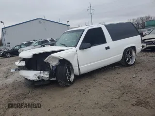 1997 GMC Yukon with VIN 3GKEC18R0VG523581, listed as a Copart auction lot 79601454 with 184,548 mi miles and Salvage Title. Bid and sale history available at carsss.com. Image 1.