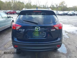 2015 Mazda CX-5 Grand Touring with VIN JM3KE4DY7F0478823, listed as a IAAI auction lot 40731626 with 82,884 mi miles. Bid and sale history available at carsss.com. Image 16.