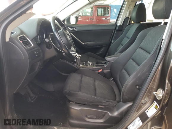 2016 Mazda CX-5 Touring z VIN JM3KE2CY4G0805072, wystawiony jako Copart lot #58435535 z przebiegiem 146 323 mil mil oraz Szkoda całkowita • Salvage title. Historia ofert i sprzedaży dostępna na DreamBid. Obrazek 7.
