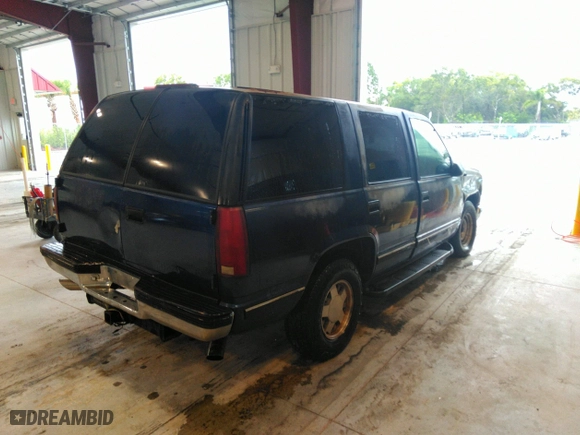 1999 Chevrolet Tahoe with VIN 1GNEC13R9XJ536325, listed as a IAAI auction lot 41475643 with 206,804 mi miles. Bid and sale history available at carsss.com. Image 4.