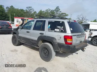 2003 Jeep Grand Cherokee Laredo z VIN 1J8GW48S33C519680, wystawiony jako IAAI lot #42126714 z przebiegiem 295 517 mil mil oraz . Historia ofert i sprzedaży dostępna na DreamBid. Obrazek 3.