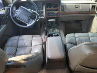 1994 Jeep Grand Cherokee Limited with VIN 1J4GZ78S1RC206288, listed as a Copart auction lot 62392685 with 207,731 mi miles and Salvage title. Bid and sale history available at DreamBid. Image 8.