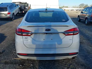 2018 Ford Fusion SE z VIN 3FA6P0H77JR108212, wystawiony jako IAAI lot #41208435 z przebiegiem 68 825 mil mil oraz . Historia ofert i sprzedaży dostępna na DreamBid. Obrazek 17.