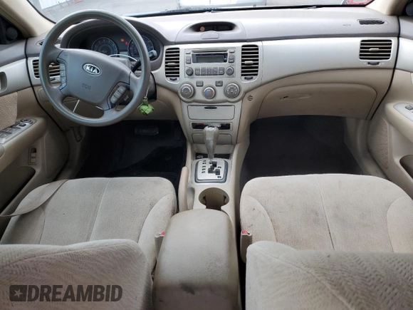2008 Kia Optima LX z VIN KNAGE124385198719, wystawiony jako Copart lot #55449255 z przebiegiem 156 972 mil mil oraz Szkoda całkowita • Salvage title. Historia ofert i sprzedaży dostępna na DreamBid. Obrazek 8.