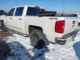 2014 Chevrolet Silverado 1500 High Country with VIN 3GCUKTEC1EG529203, listed as a IAAI auction lot 41643824 with 153,176 mi miles and . Bid and sale history available at DreamBid. Image 3.